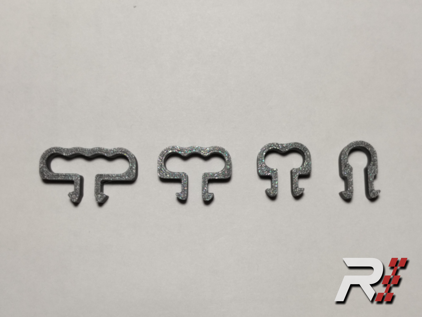 “RaceCraft 3D gray snap-fit cable clip set including single, double, triple, and quad clips for aluminum profile sim rigs.”