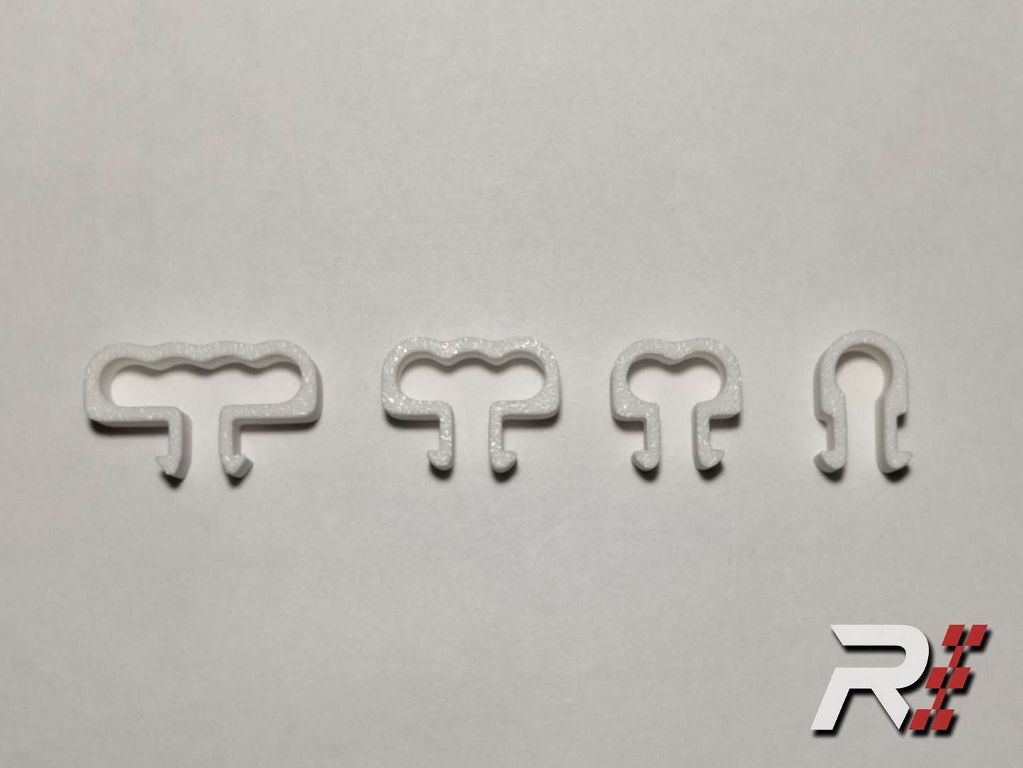 “RaceCraft 3D white snap-fit cable clip set showing single, double, triple, and quad clips for aluminum profile sim rig cable management.”